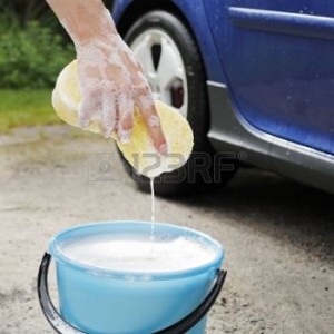 5279776-hand-holding-a-soapy-sponge-used-to-wash-the-car